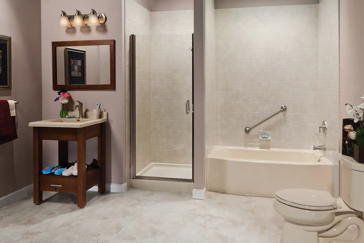 Biscuit curved tub and shower base with travertine tile and brushed nickel