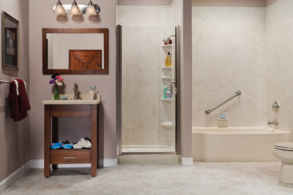 Biscuit tub and travertine tile shower in showroom
