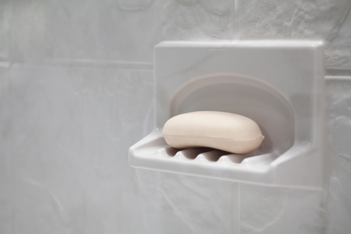 Flush-mount soap dish in marble-look wall surround
